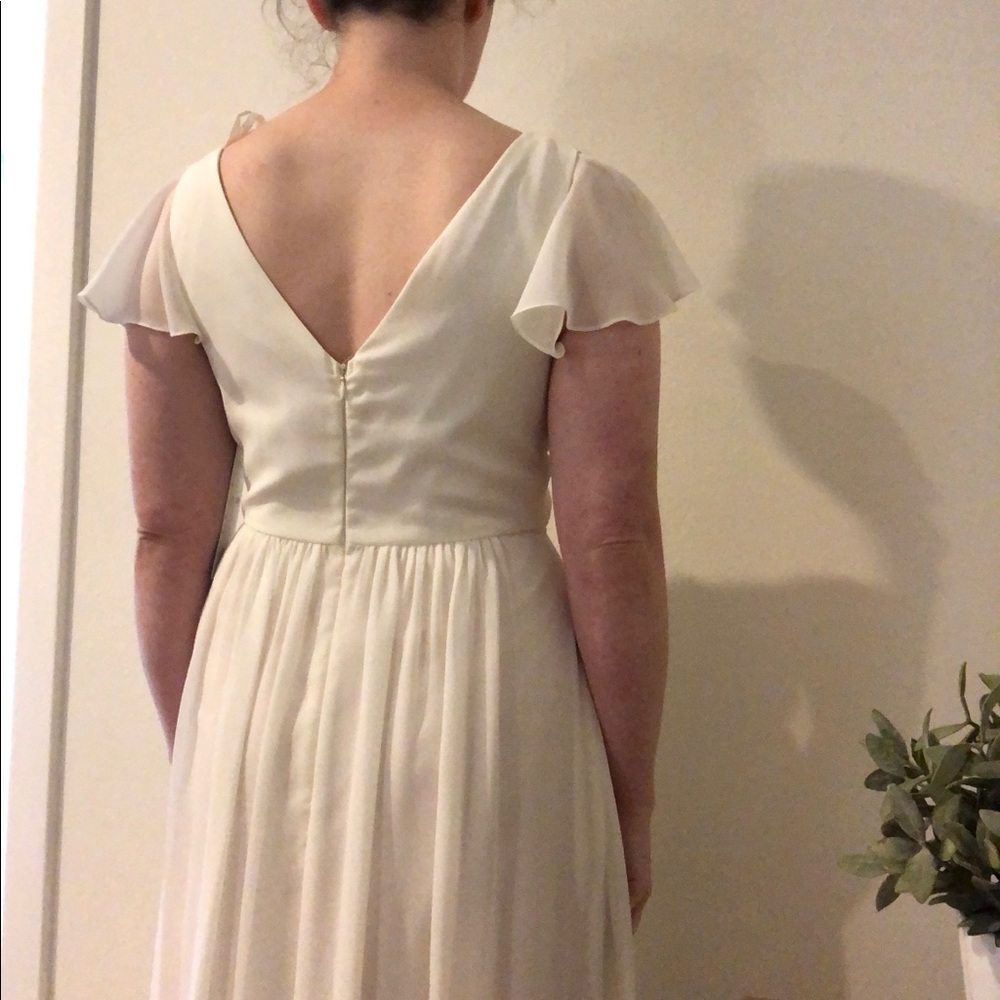 Elegant Ivory Wrap-Front Wedding Dress with Flutter Sleeves